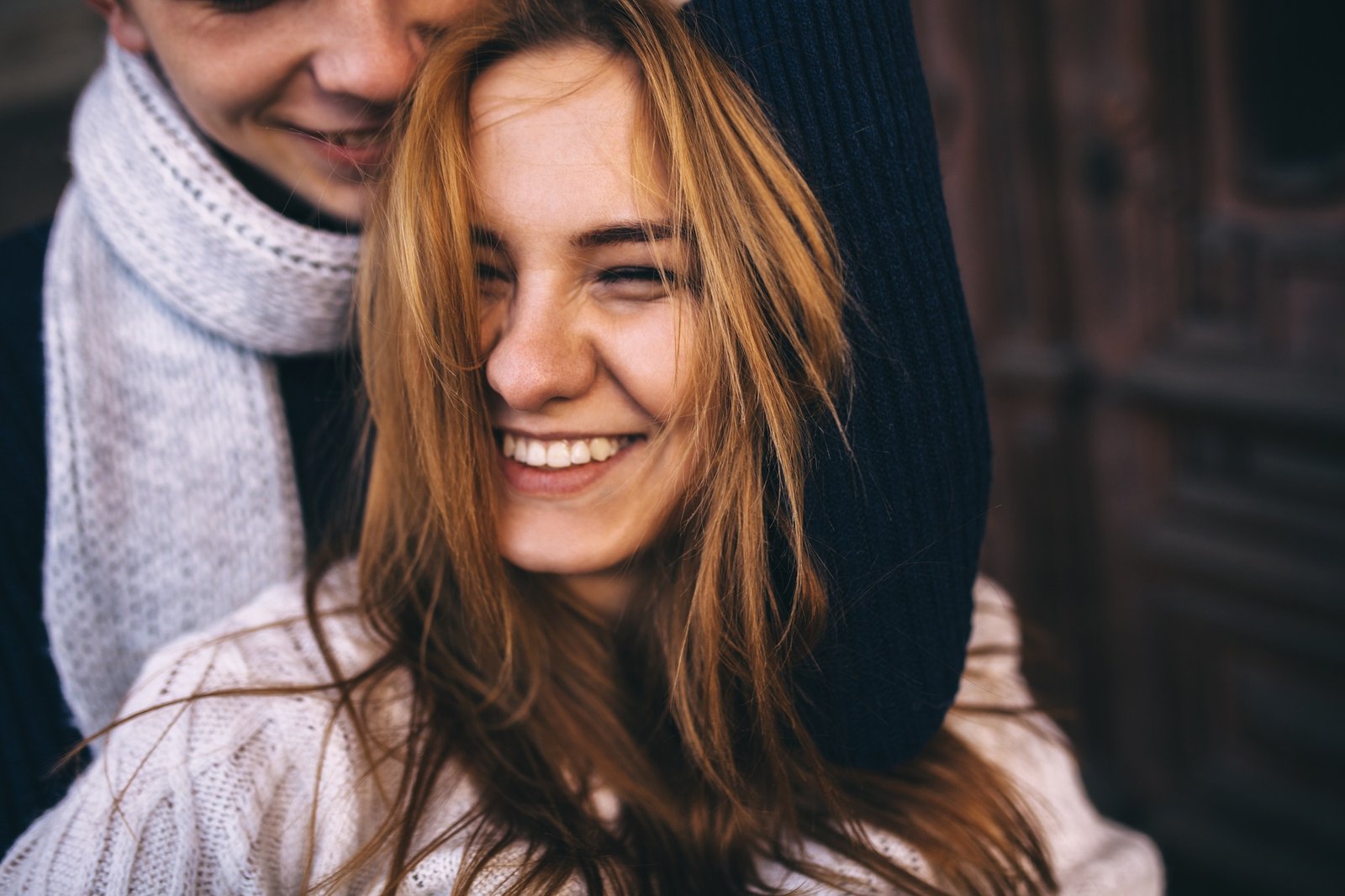 Close up portrait of happy boyfriend hugging his girlfriend